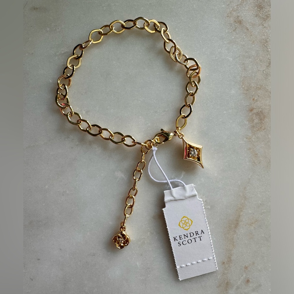 Brand new with tags KENDRA SCOTT gold chain bracelet with charm!